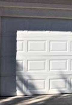 Old Garage Door Panel Repair Near Palm Harbor